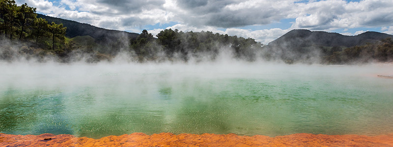 Colourful steaming geothermal pool.